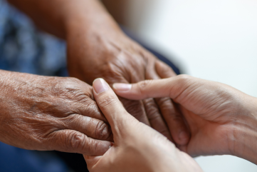 holding old person's hand